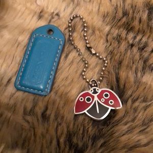 COACH ladybug and turquoise hangtag